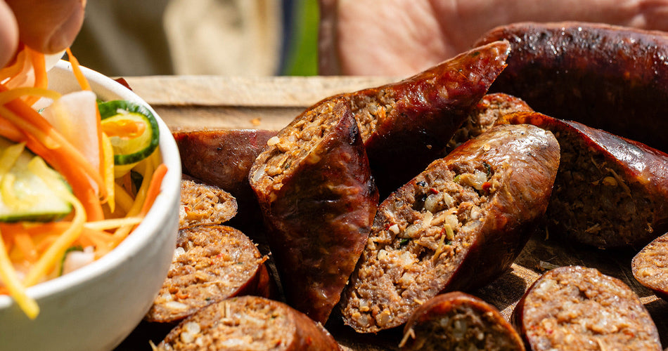 classic Cumberland sausage slowly cooked in a frying pan and the collection highlight for sausages & sausagemeat
